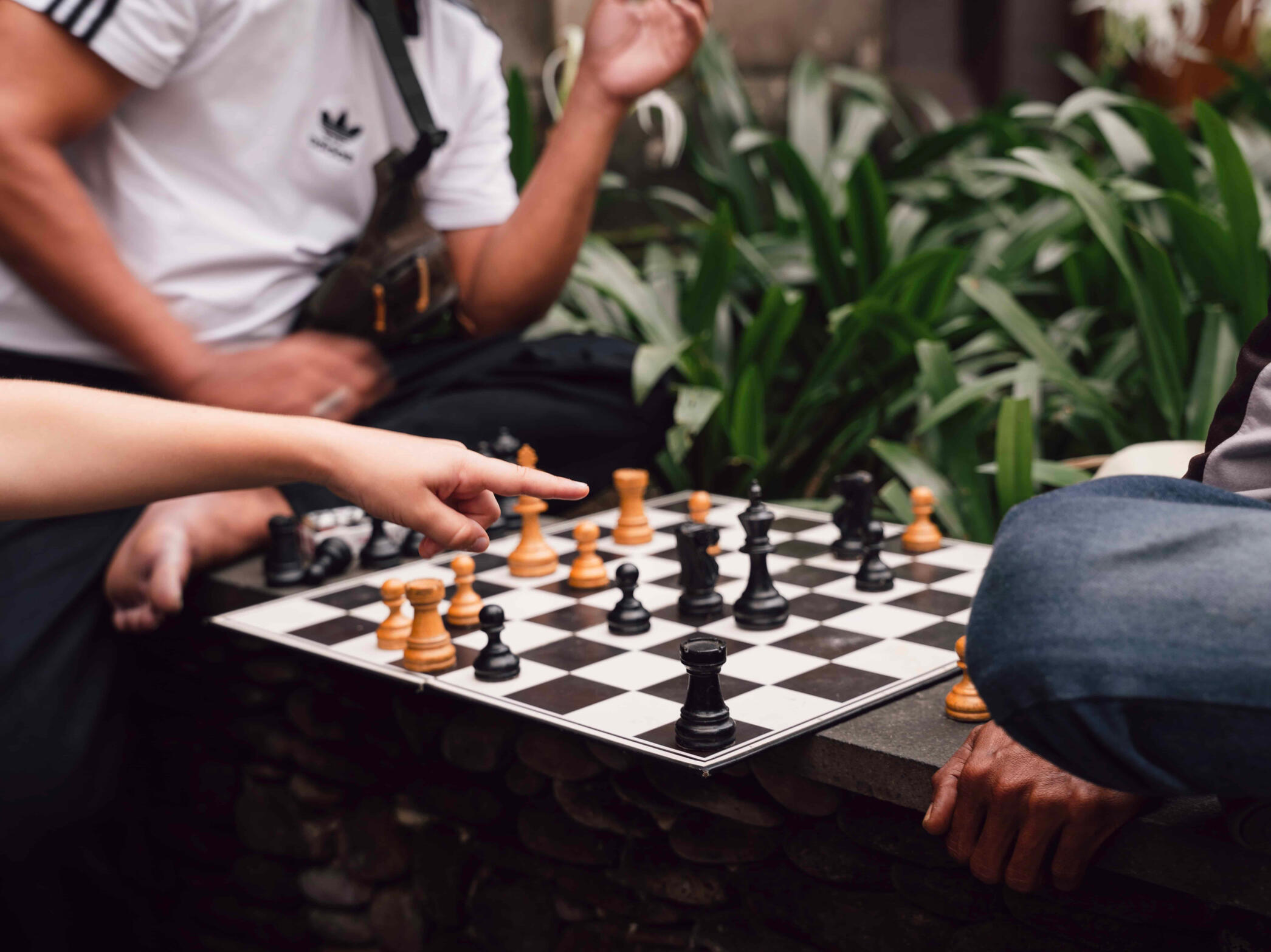 Chess in Public - A beautiful moment that was filled with engagement between strangers who soon to become friends after a game of Chess. The hand is for a Spanish girl from Madrid specifically who was also engaged with the game along with her dad.